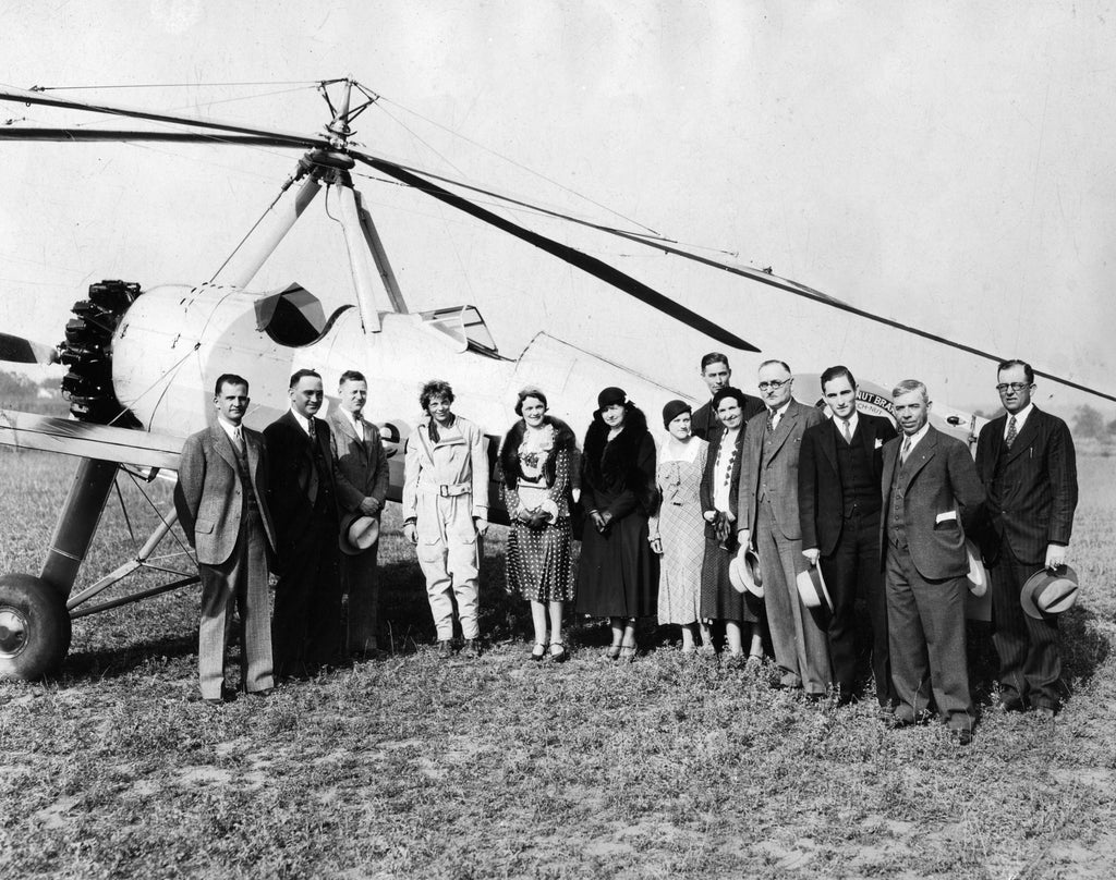 Amelia Earhart poses with locals in front of an autogiro at the Anderson Airport, 1931. Her visit was part of her Beech Nut Gum promotional tour that year. -- Anderson County Museum