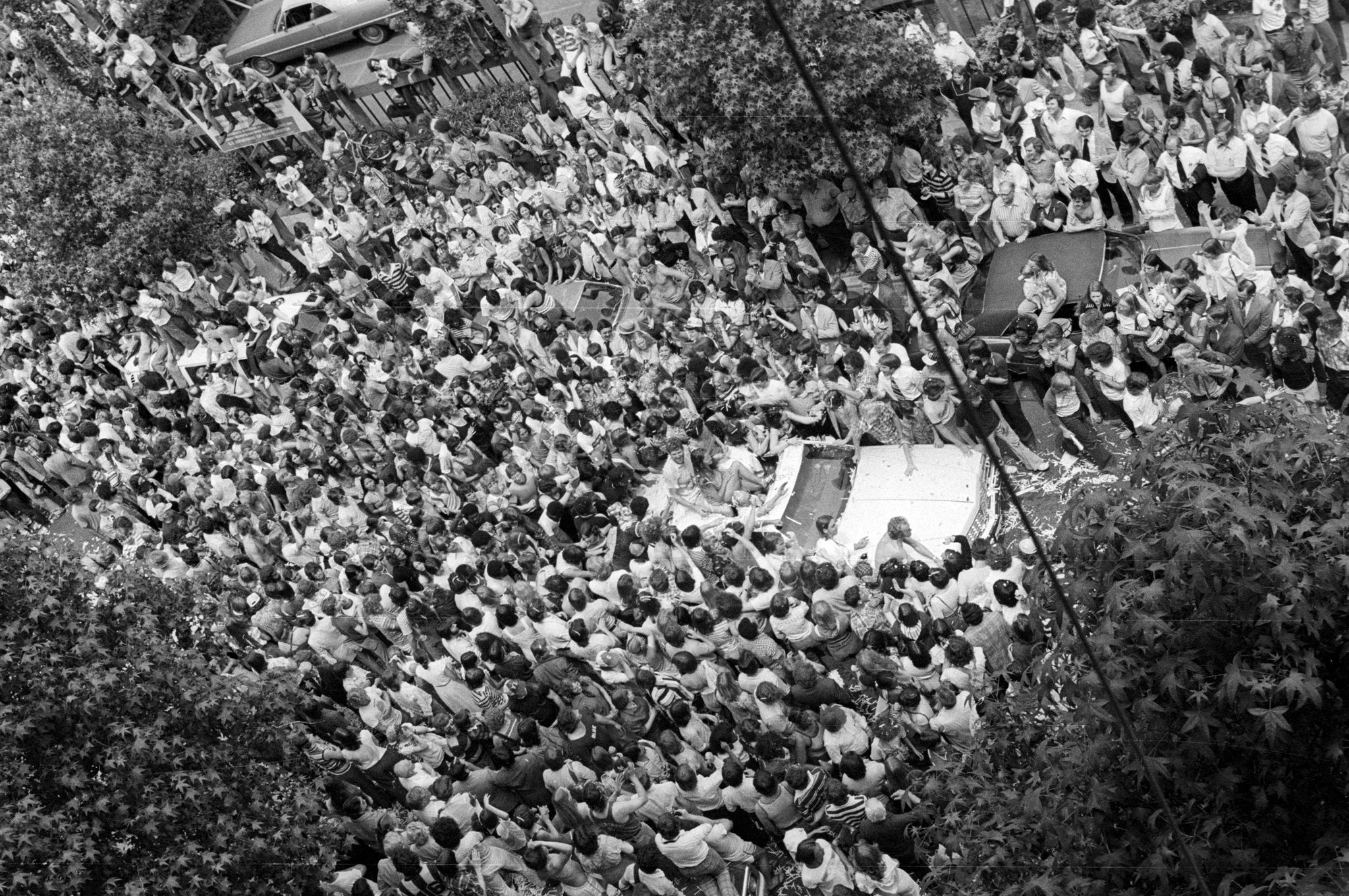 Blazers fans surround the convertible Bill Walton is riding in during the Blazers’ 1977 victory parade. Walton initially tried to ride his bike, but the sea of fans made it impossible. -- ROGER JENSEN / THE OREGONIAN/OREGONLIVE
