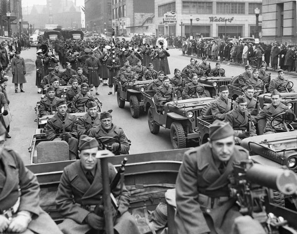 A squad of peeps from Pine Camp descend on Niagara Square from Court Street in the Army Day Parade, April 1942. The peep was smaller than its better-known brother, the jeep, and could cross almost every kind of terrain; mud, sand and shallow water. -- BUFFALO NEWS ARCHIVES
