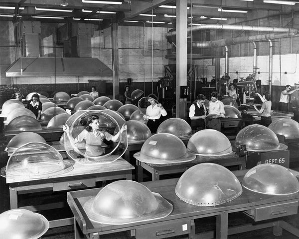Bell Aircraft workers inspect machine gun turrets in 1944. -- BUFFALO NEWS ARCHIVES