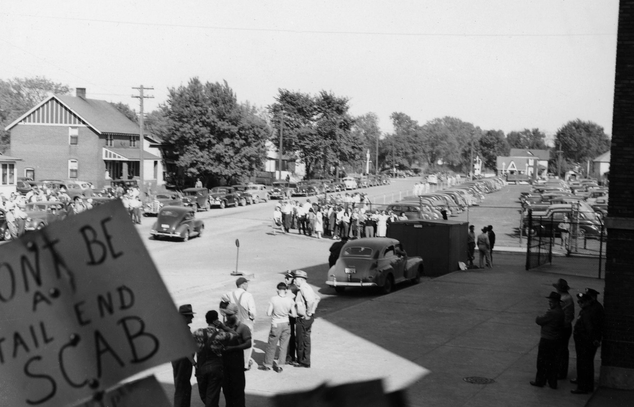 Picketers on Sycamore Street during a Rath Packing Company strike in 1948. -- Leo R. Larson