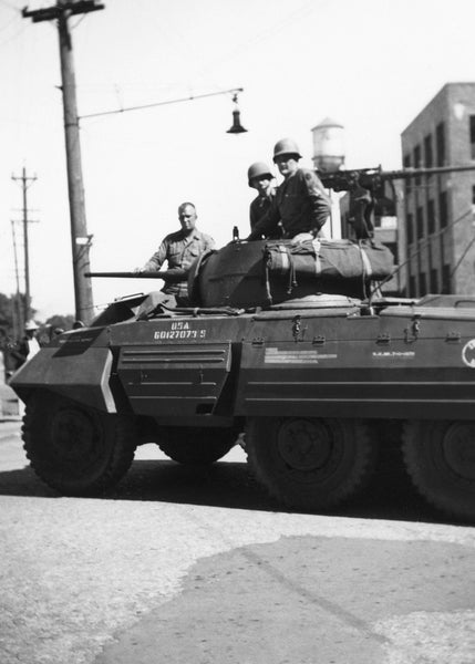 The national guard in their tank for the Rath Packing Company strike in 1948. -- Leo R. Larson