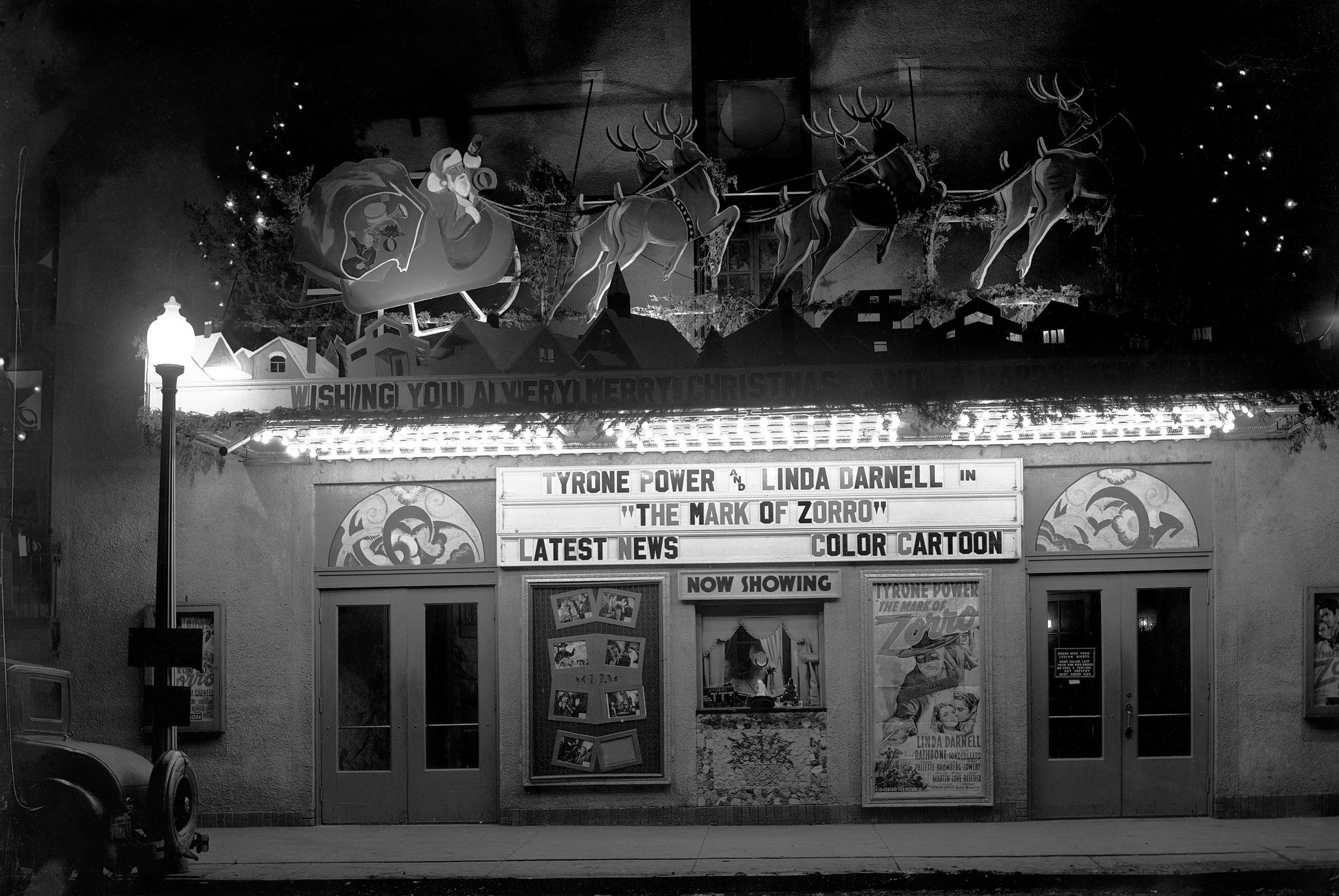 The Hot Springs Theater decorated for the holiday season and advertising “The Mark of Zorro,” circa 1940. -- Fall River Historical Society