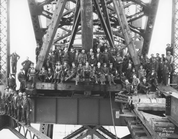 Workers on top of the nearly completed Longview Bridge in 1930. -- Longview Public Library