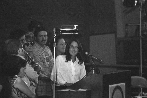 Folk artist Joan Baez sings at the First Constitutional Convention of the United Farm Workers Union, September 21, 1973. -- Courtesy Howard Watkins