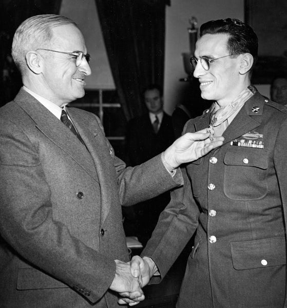 Sergeant Vito Bertoldo receiving the Congressional Medal of Honor from President Truman for his service in Hatten, France during World War II, January, 1945. -- Brent Wielt