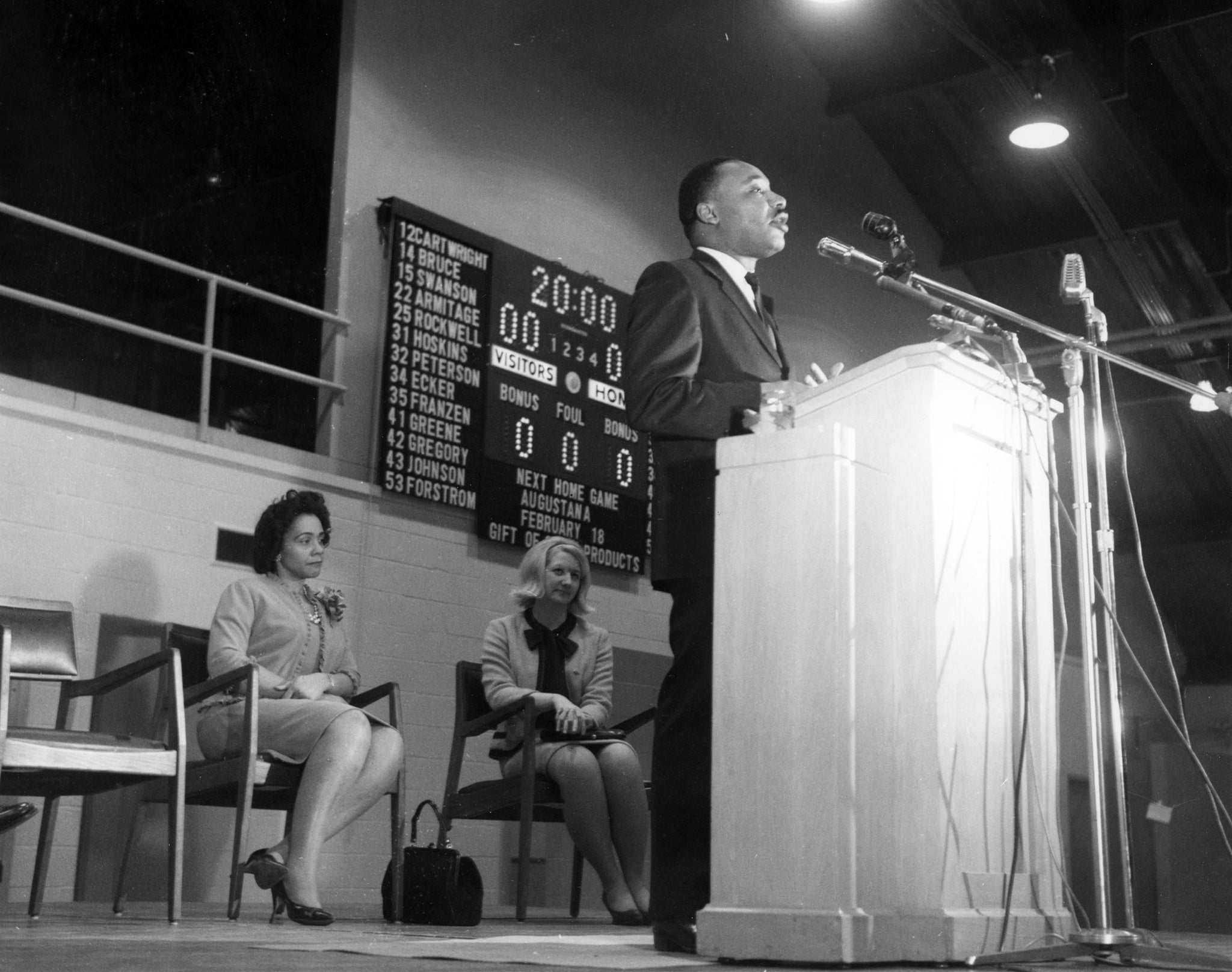 Reverend Doctor Martin Luther King Jr. speaking on the Illinois Wesleyan University campus on February 2, 1966. Behind him are Coretta Scott King and Elizabeth Lindblom. -- Courtesy Tate Archives & Special Collections, The Ames Library, Illinois Wesleyan University, Bloomington, Illinois