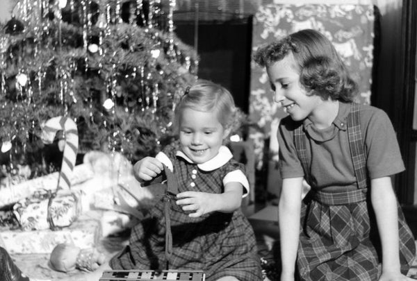 Rosalie and Corinne Dias on Christmas morning, 158 Melrose Street, Modesto, 1956. -- Rosalie Hill