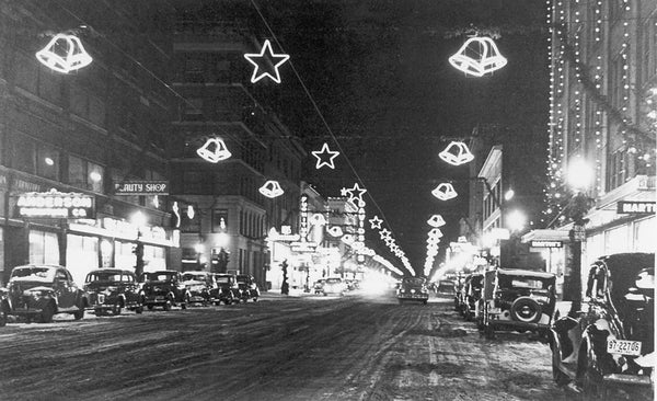 Lights from the Christmas display on Fourth Street, Sioux City, 1941. This view looks west toward Nebraska Street.  -- Sioux City Public Museum