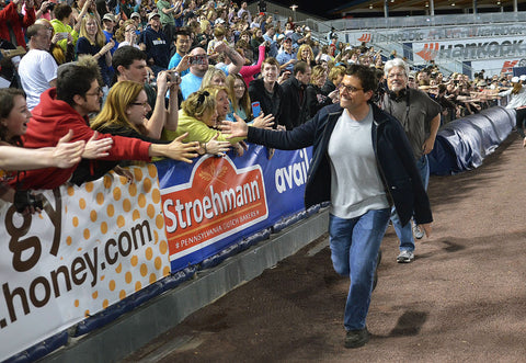 Steve Carell made a surprise appearance at "The Office" Wrap Party at PNC Field, as he runs down the line high-fiving fans. -- Scranton Times-Tribune Archives