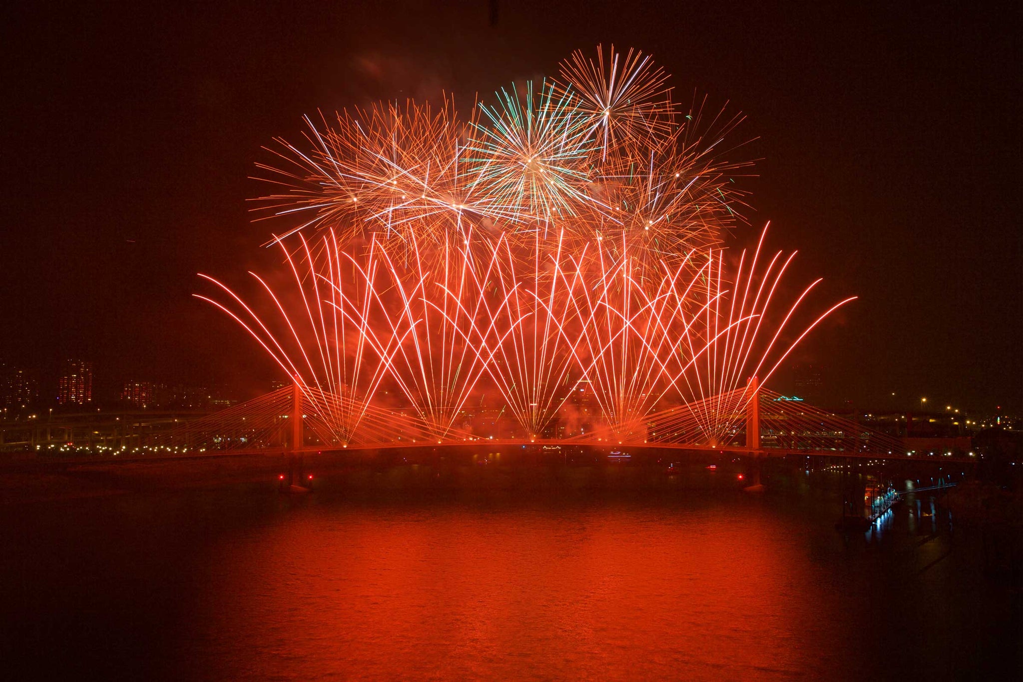 Trimet launched fireworks off the new Tilikum Crossing Bridge to cap their MAX Orange line picnic at the Zidell Yards next to the Willamette River on Saturday, Aug. 22, 2015. -- Randy L. Rasmussen/The Oregonian/OregonLive