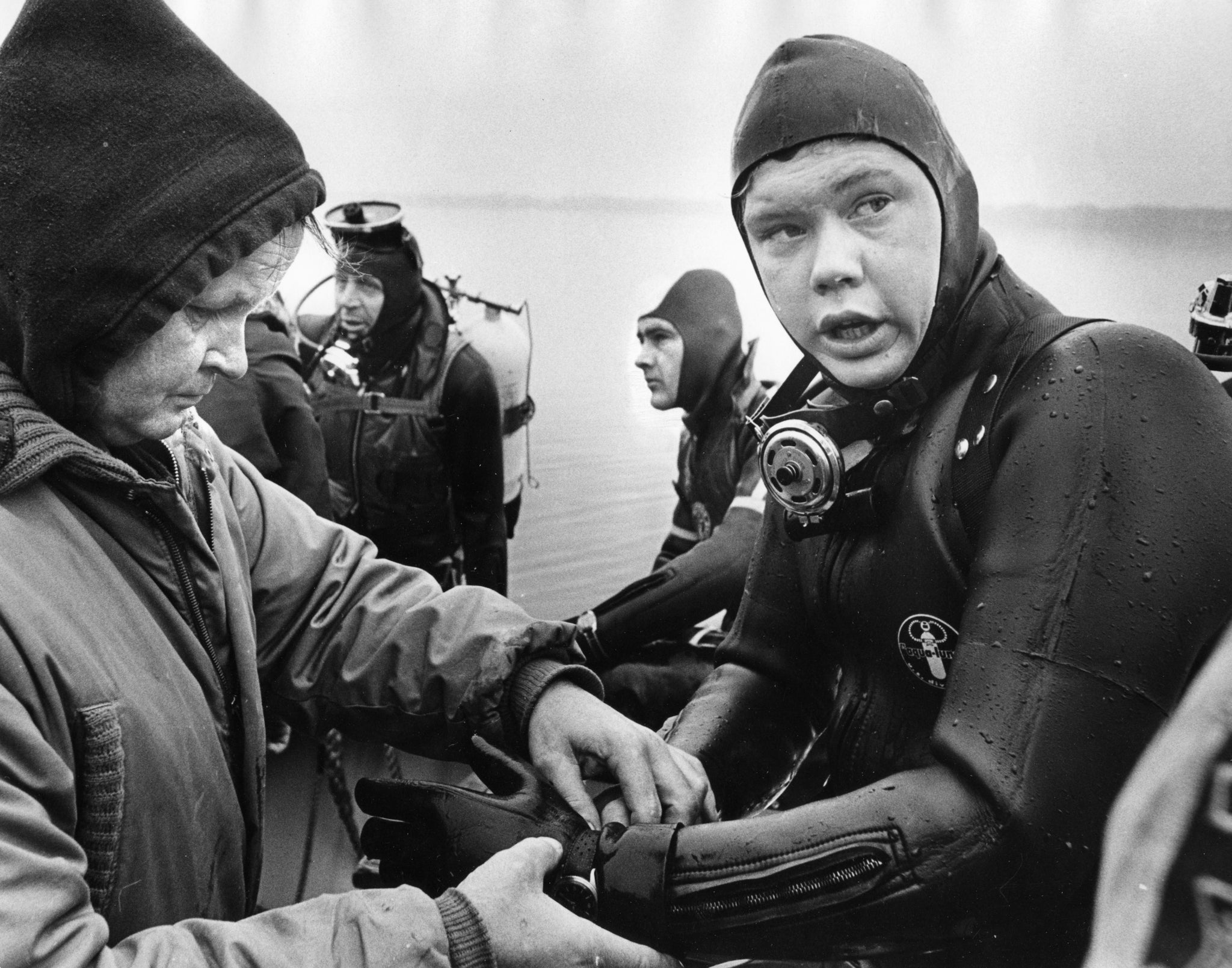 In diving suits, from left, Charles Campbell, Travis Brann and Phil Sharrow following their first dive on soul and R&B star Otis Redding's wrecked Beechcraft H18 aircraft, December 1967.  -- Wisconsin State Journal