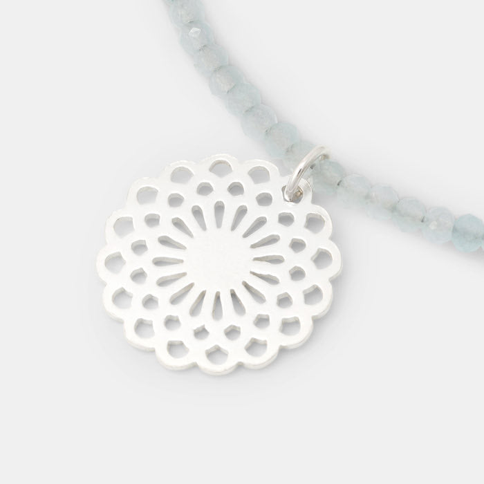 Sterling silver dahlia pendant on blue chalcedony necklace.