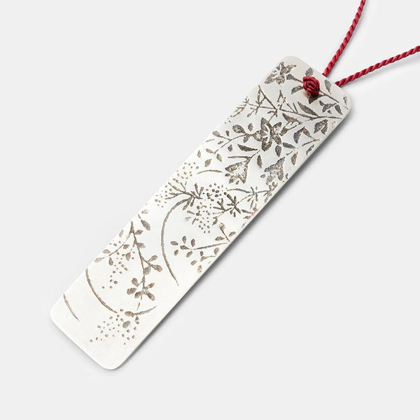 Japanese etched pendant in sterling silver on silk necklace.