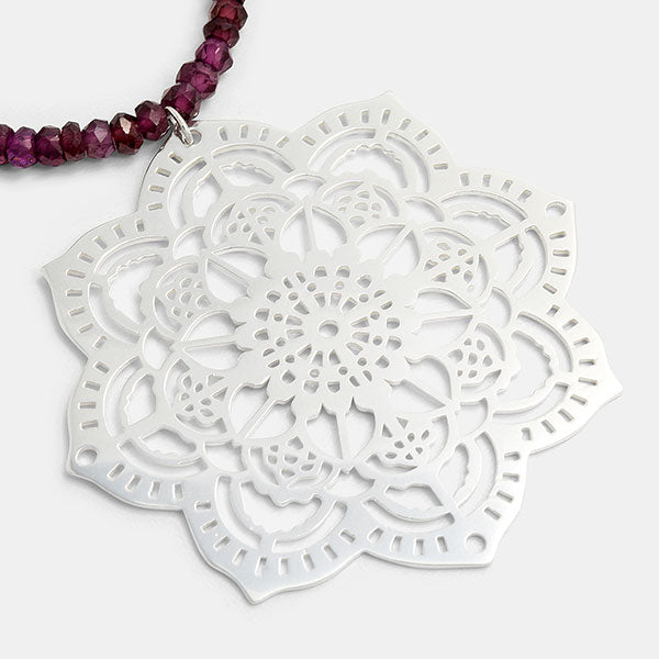 Mehndi mandala pendant with rhodolite garnet beaded necklace by Australian jeweller Simone Walsh.