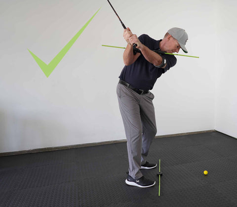 Photo of correct spine angle at the top of your golf swing