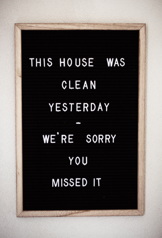 Hanging framed quote: "This house was clean yesterday. We're sorry you missed it"