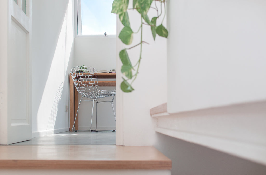 Photo of a sunlit room as you walk upstairs