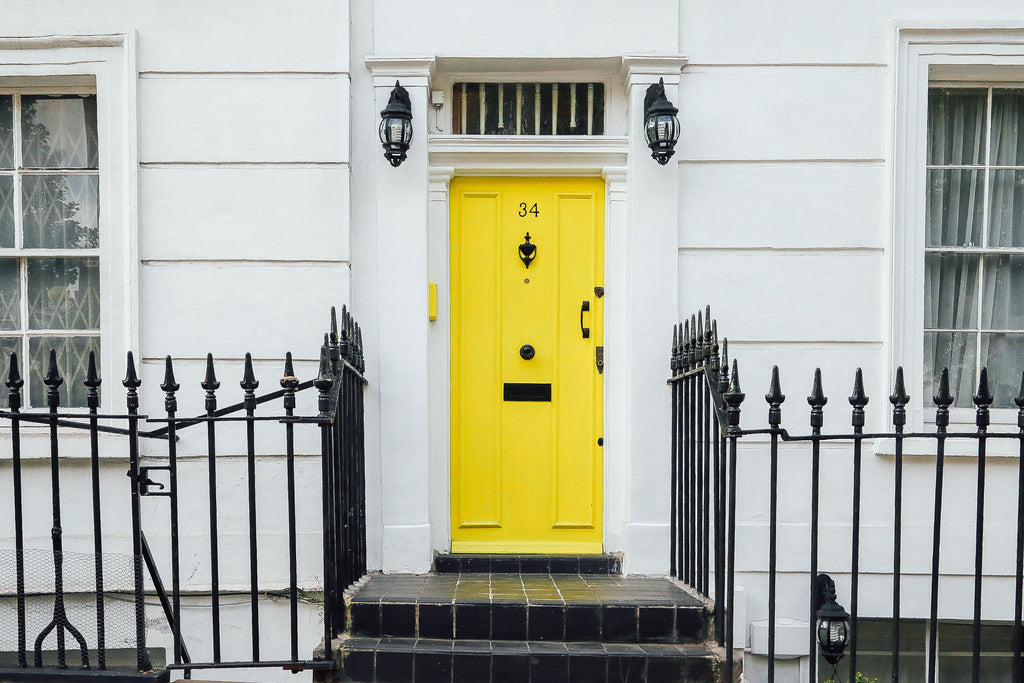 Stand out yellow door for a white home