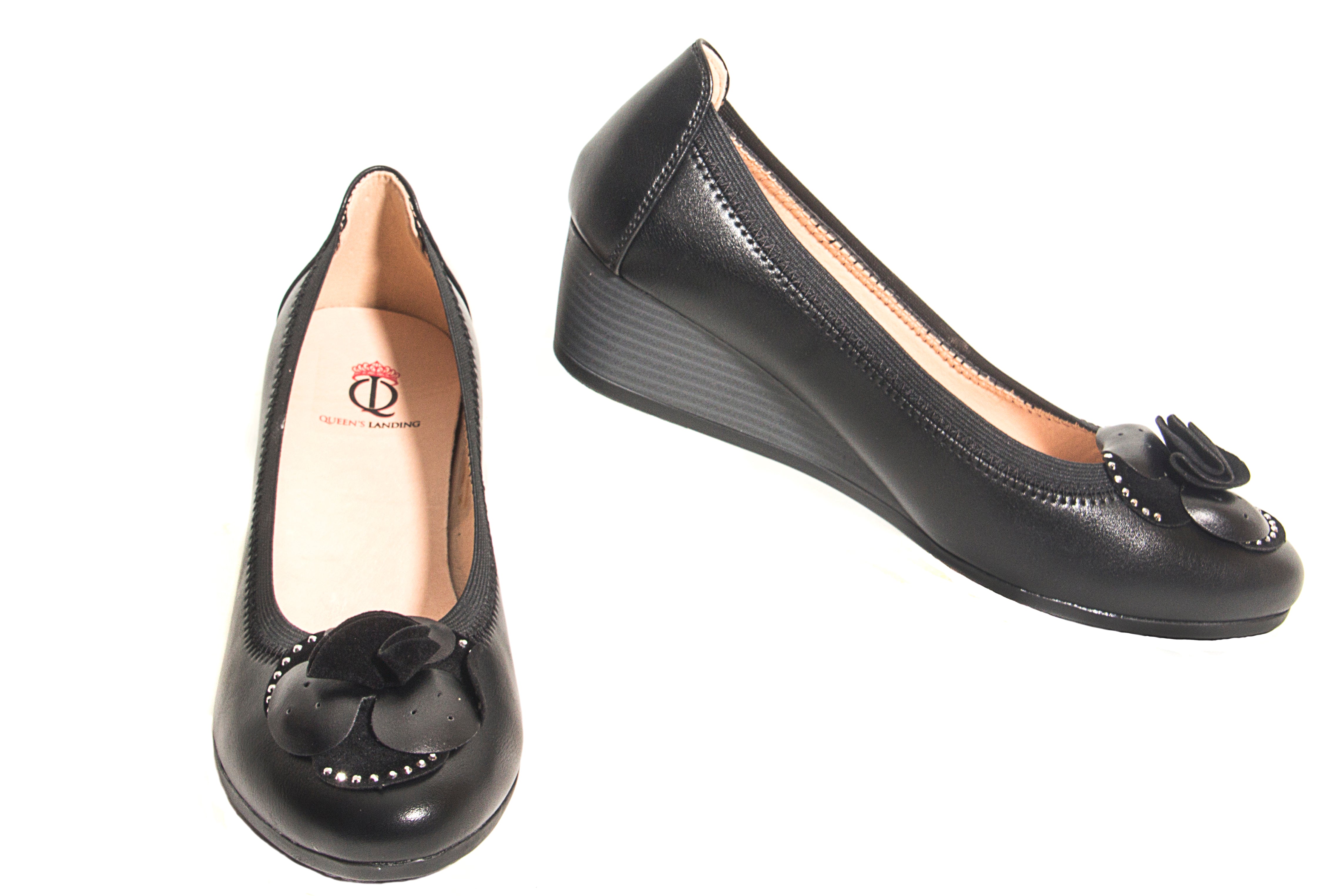 Soft and comfie leather Black color slip on wedge shoes with big sparkley flower center piece on the front