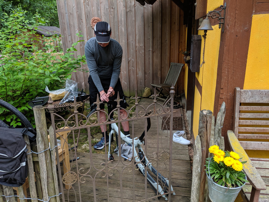 Photo of Jim re-assembling a Cruzbike Q45 adventure touring recumbent bike in Rothenburg ob der Tauber
