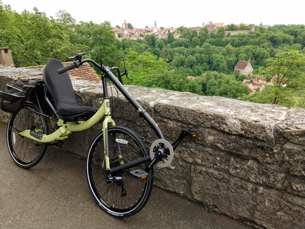 Photo of a Cruzbike Q45 adventure touring recumbent bike overlooking a village in the Bavarian country side.