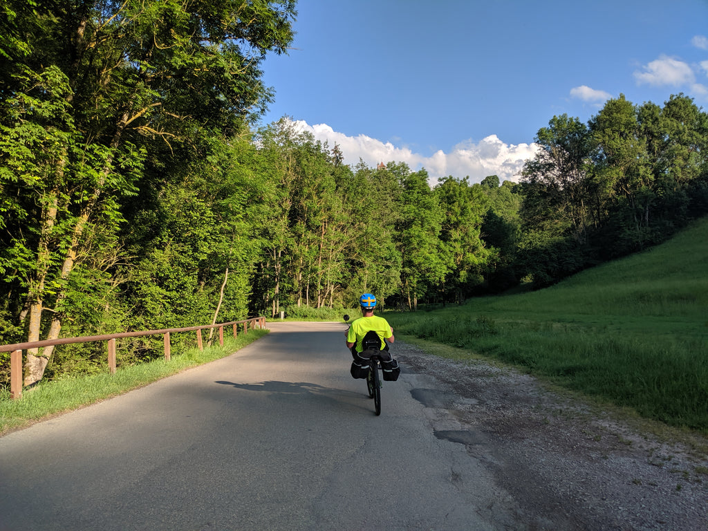 Photo of Jim riding his Q45 touring recumbent bike on a road in Bavaria
