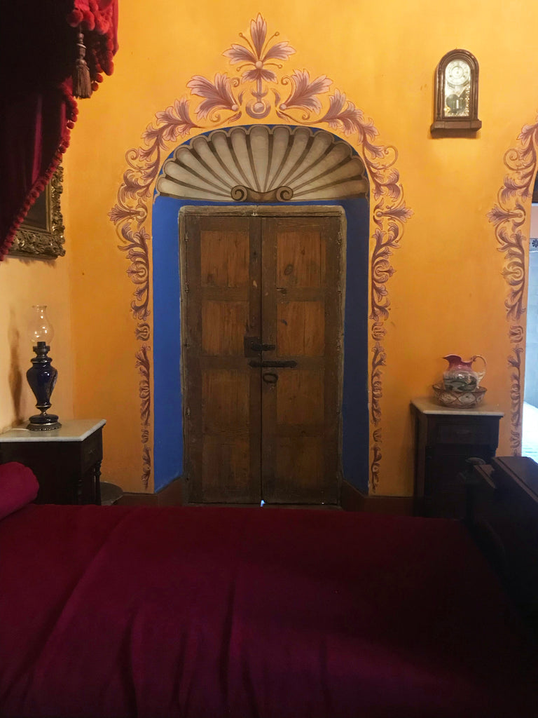 ex-hacienda_san gabriel de barrera_gardens_stucco_stone_yellow_mustard_handpainted_bedroom_door surround_doors