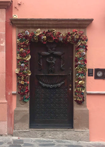 carved_wood_door_hacienda_architecture_casa_san miguel_mexico_pink_stucco