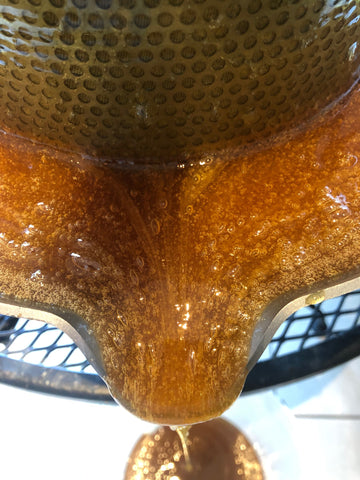 Small air bubbles are trapped inside the New Forest Heather Honey 