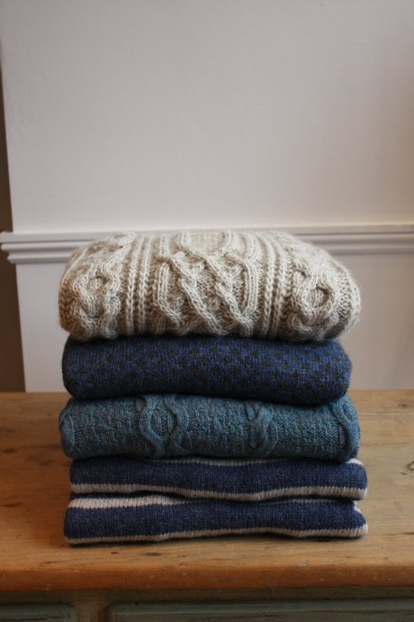 folded wool sweaters