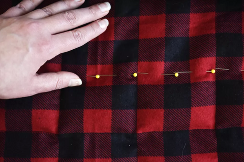 pins and needles on a weighted blanket fabric
