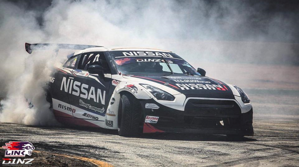 Nissan Darren Kelly D1NZ car drifting in a competition.