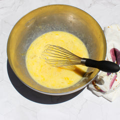 Eggs in bowl with milk and spices (after whisked)