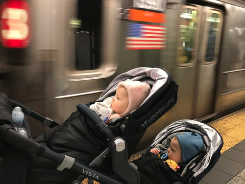 Twins waiting for the subway to go to the Garment District to check on the nursing dress in production