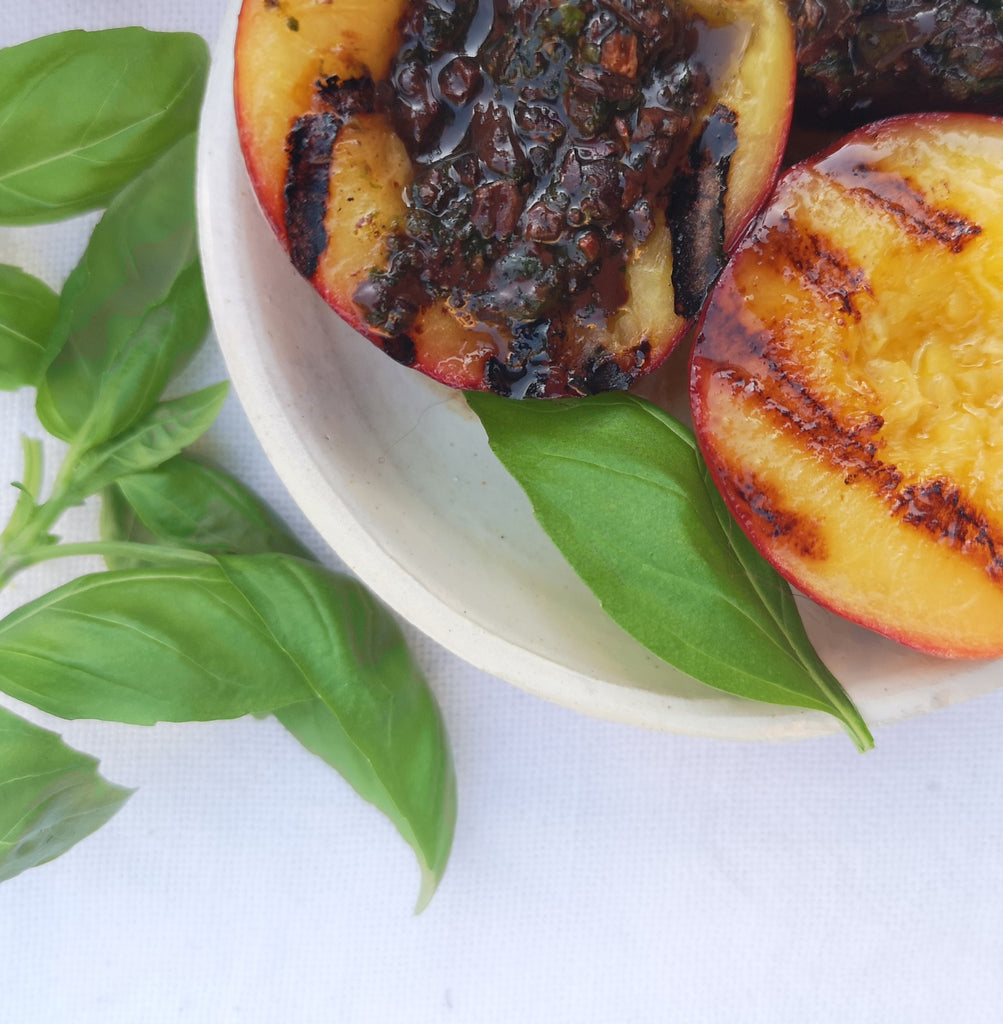 Grilled Nectarines with Cocoa Nib, lime  and Finca la Torre Pesto