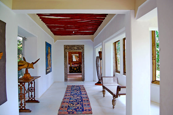 Colour pop | With artwork, hall runner and painted timber rafters at The Majlis Lamu, Kenya
