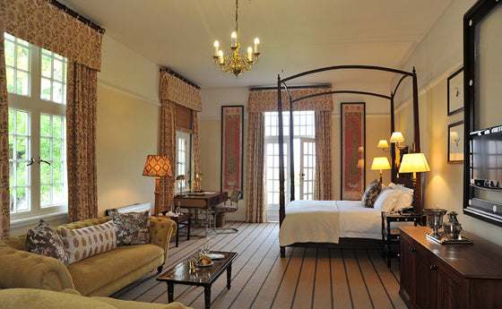 Four-poster beds | Colonial grace of the grand Stable Suite at the Victoria Falls Hotel, Zimbabwe