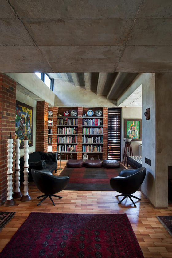 Library style | Brick and concrete modern industrial book shelves in a Pierneef [Pretoria] residence, South Africa