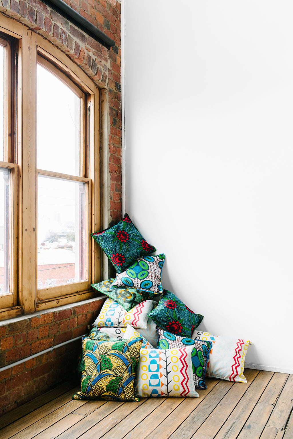 Safari Journal / Blog by Safari Fusion | Cushion stack | Chitenche Cushions from Malawi made fabric and block-print Safari Cushions created in South Africa for Safari Fusion