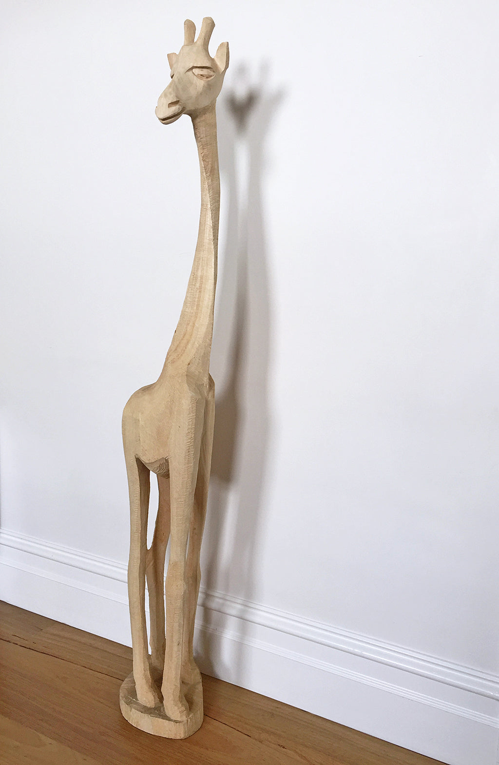 Animal instincts / giraffe | Swazi Giraffe, a chainsaw Jacaranda wood carving from Eswatini [Swaziland]