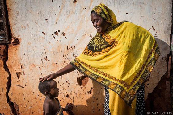 Colour crush / yellow | Mother and child, Kigoma Tanzania photograph by Mia Collis