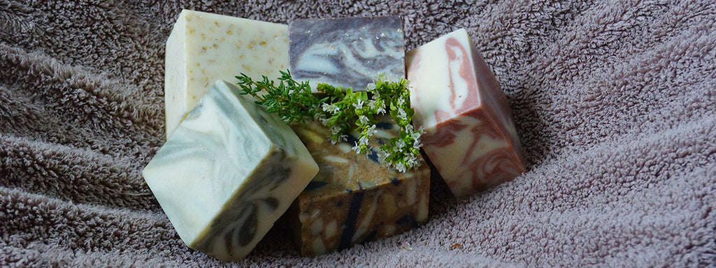 Small pile of marbled soap blocks on a towel