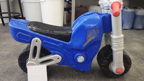 A push motorbike for children made out of plastic