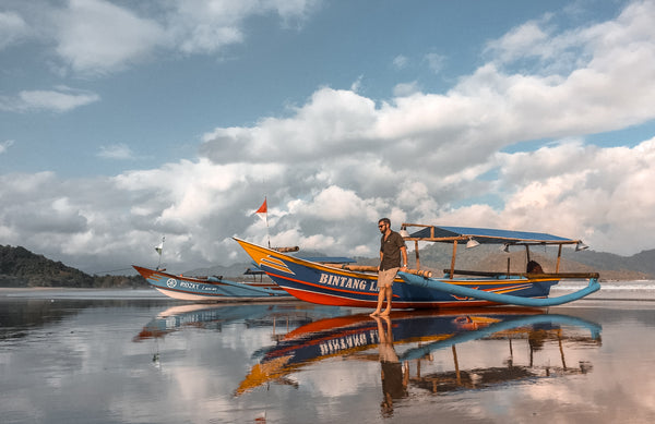 Forrest Galante leaning on a boat