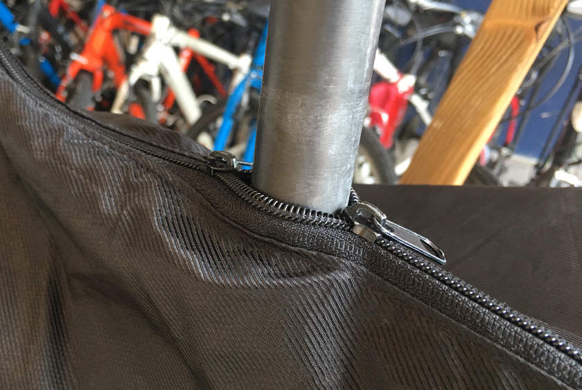 Bag zipped up around seat post.