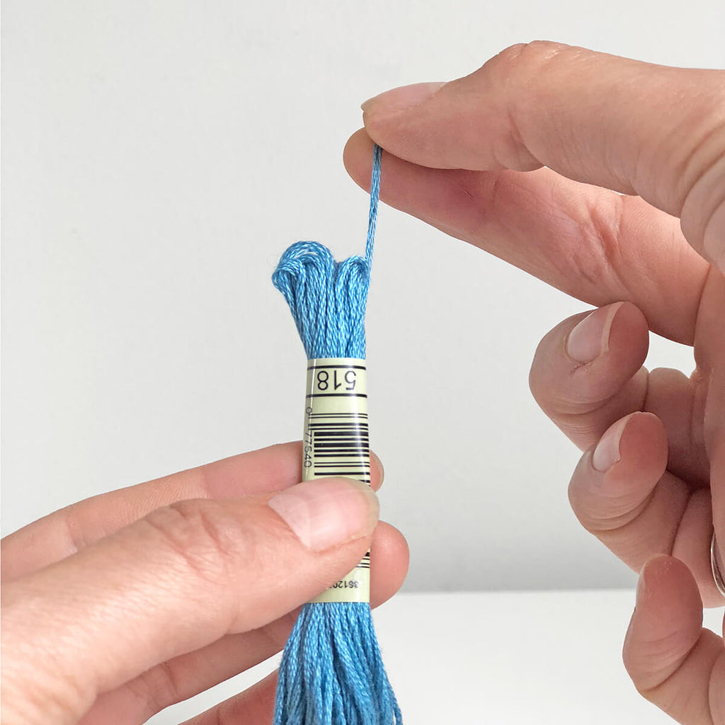 Pull the thread from the skein - how to cross stitch