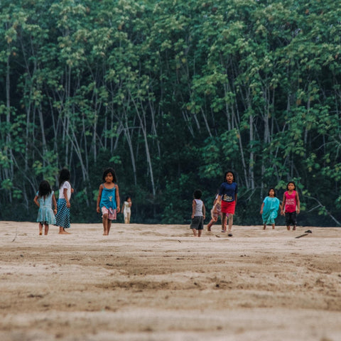 The Greatest Gift of All is the Gift of Giving, image of Brazilians in the rainforest.