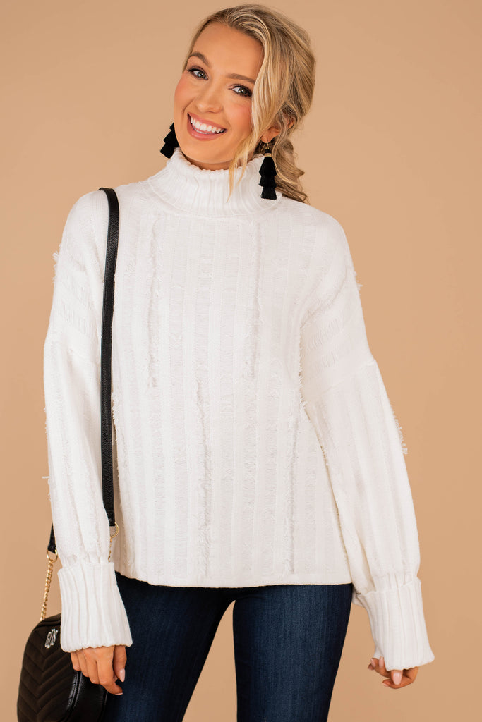 white frayed sweater