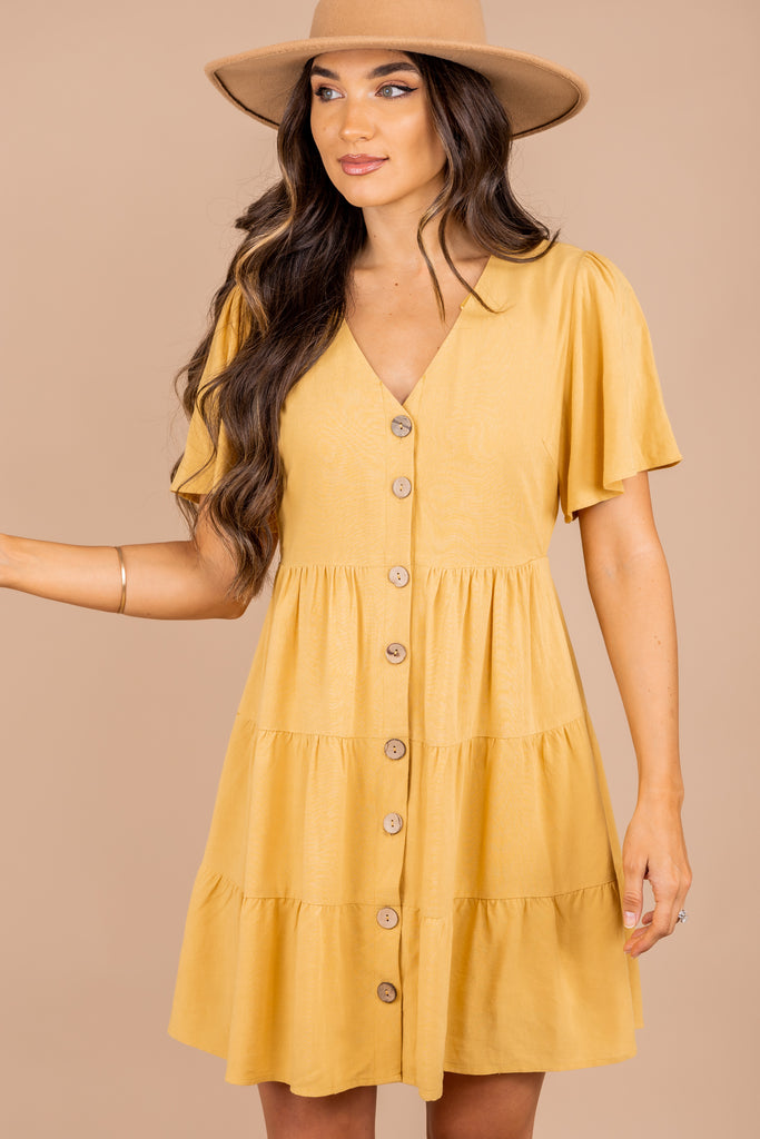 yellow dress with buttons down the front